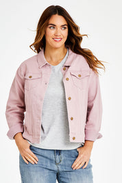 Model Laura wearing size 14 of The Denim Jacket in colour Dustypink (Pink), from the front, cropped image