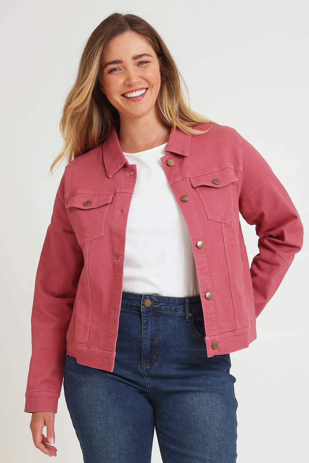 Model Chanel wearing size 16 of The Denim Jacket in colour Smokeyrose (Pink), from the front, cropped image