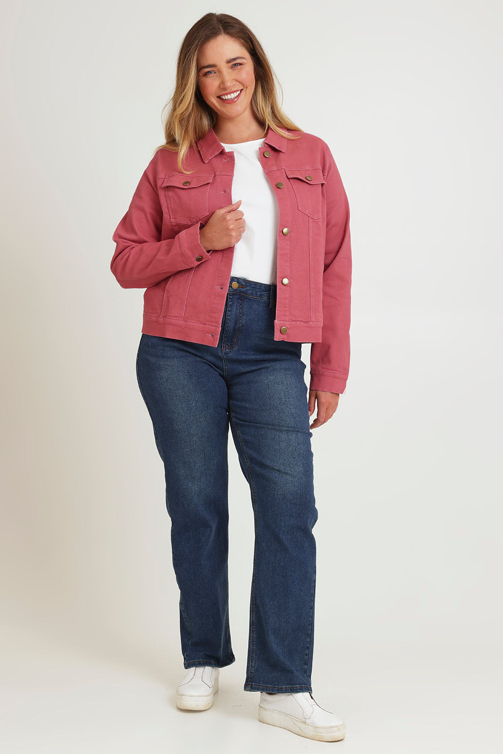 Model Chanel wearing size 16 of The Denim Jacket in colour Smokeyrose (Pink), from the front, showing the whole outfit