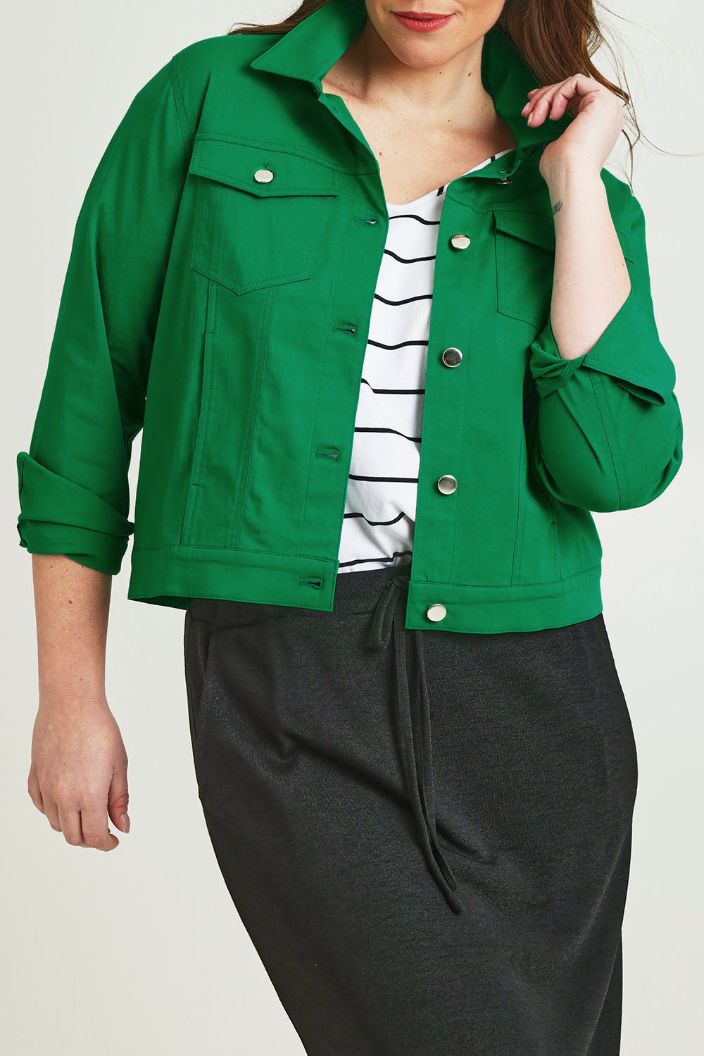 Model Jane wearing size 14 of The Tencel Blend Denim Jacket in colour Emerald (Green), from the front, cropped image