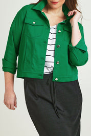 Model Jane wearing size 14 of The Tencel Blend Denim Jacket in colour Emerald (Green), from the front, cropped image