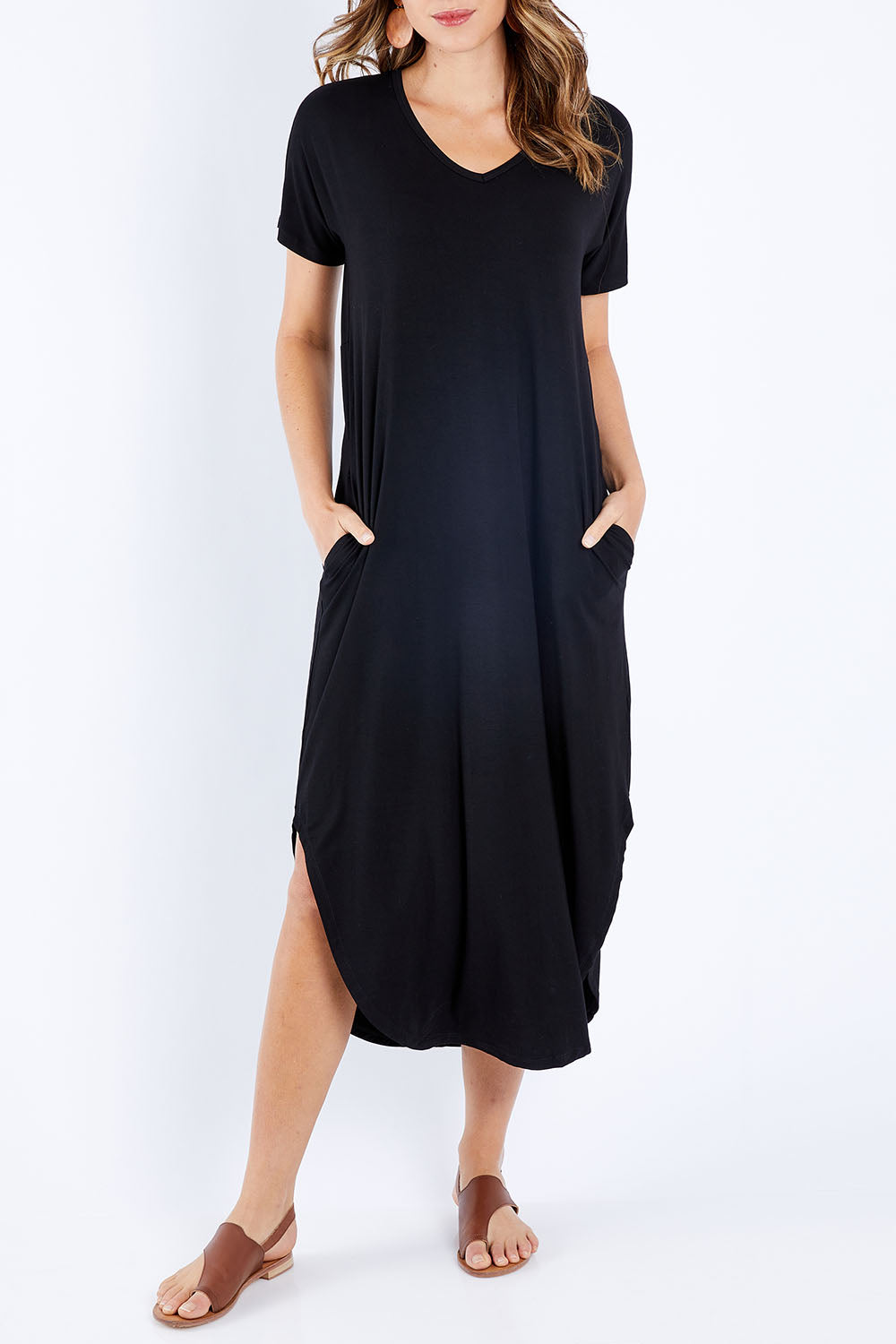Model Madeline wearing size 10 of The Cotton Blend Maxi in colour Black (Black), from the front, cropped image