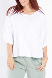 Model Laura wearing size 14 of The Split Sleeve Tee in colour White (White), from the front, cropped image