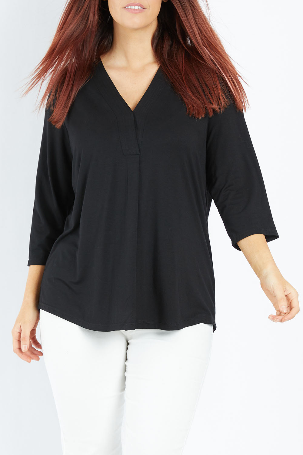 Model Laura wearing size 14 of The Stitch Detail Top in colour Black (Black), from the front, showing the whole outfit