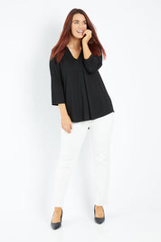 Model Laura wearing size 14 of The Stitch Detail Top in colour Black (Black), from the front, showing the whole outfit