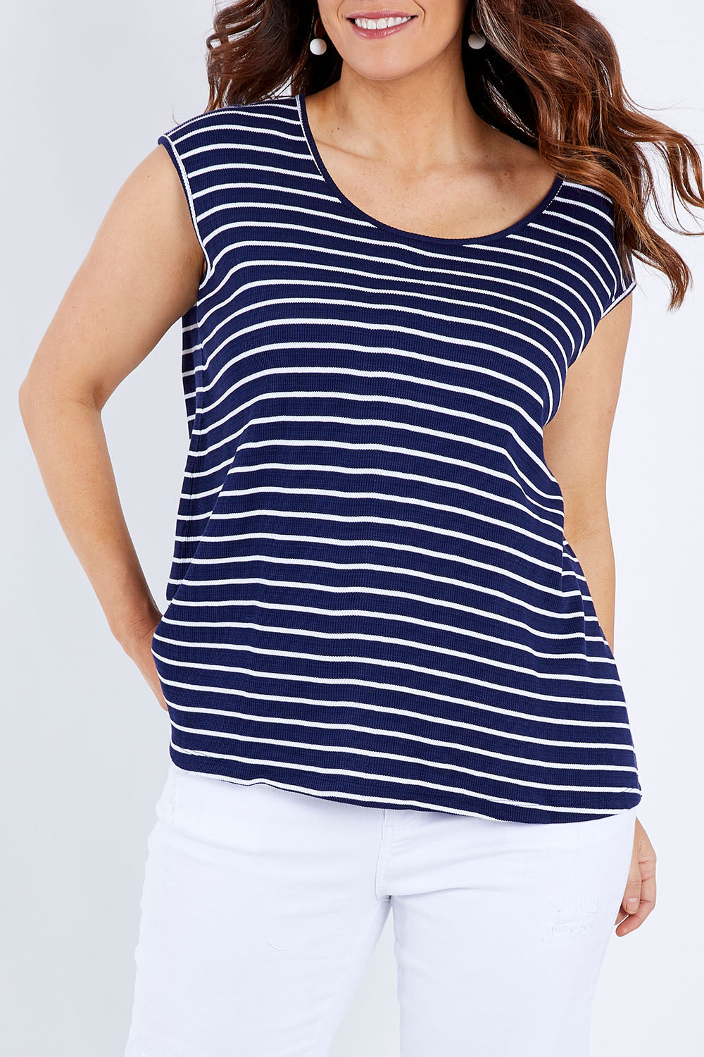 Model Laura wearing size M of The Textured Stripe Tank in colour Stripe (Blue), from the front, cropped image