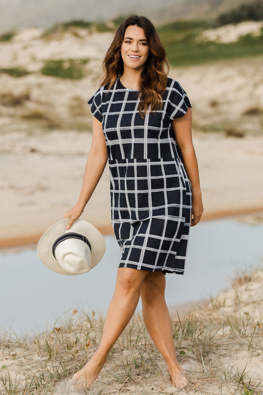 Model Laura wearing size 14 of The Check Shift Dress in colour Navy (Blue), from the front, showing the whole outfit