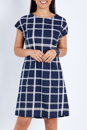 Model Pamela wearing size 10 of The Check Shift Dress in colour Navy (Blue), from the front, cropped image