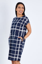 Model Pamela wearing size 10 of The Check Shift Dress in colour Navy (Blue), from the front, cropped image