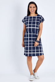 Model Pamela wearing size 10 of The Check Shift Dress in colour Navy (Blue), from the front, showing the whole outfit