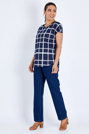 Model Pamela wearing size 10 of The Check Scoop Neck Tee in colour Navy (Blue), from the front, showing the whole outfit