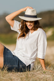 Model Laura wearing size 14 of The Panel Detail Tee in colour White (White), from the front, showing the whole outfit