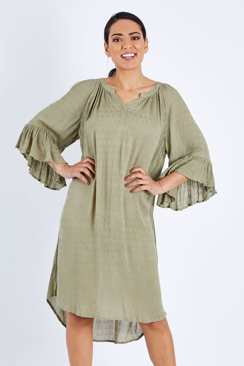 Model Pamela wearing size 10 of The Flute Sleeve Textured Dress in colour Khaki (Green), from the front, cropped image
