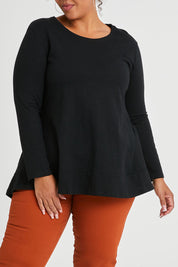 Model Alexis wearing size 16 of The Long Sleeve Swing Tee in colour Black (Black), from the front, cropped image