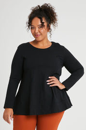 Model Alexis wearing size 16 of The Long Sleeve Swing Tee in colour Black (Black), from the front, cropped image