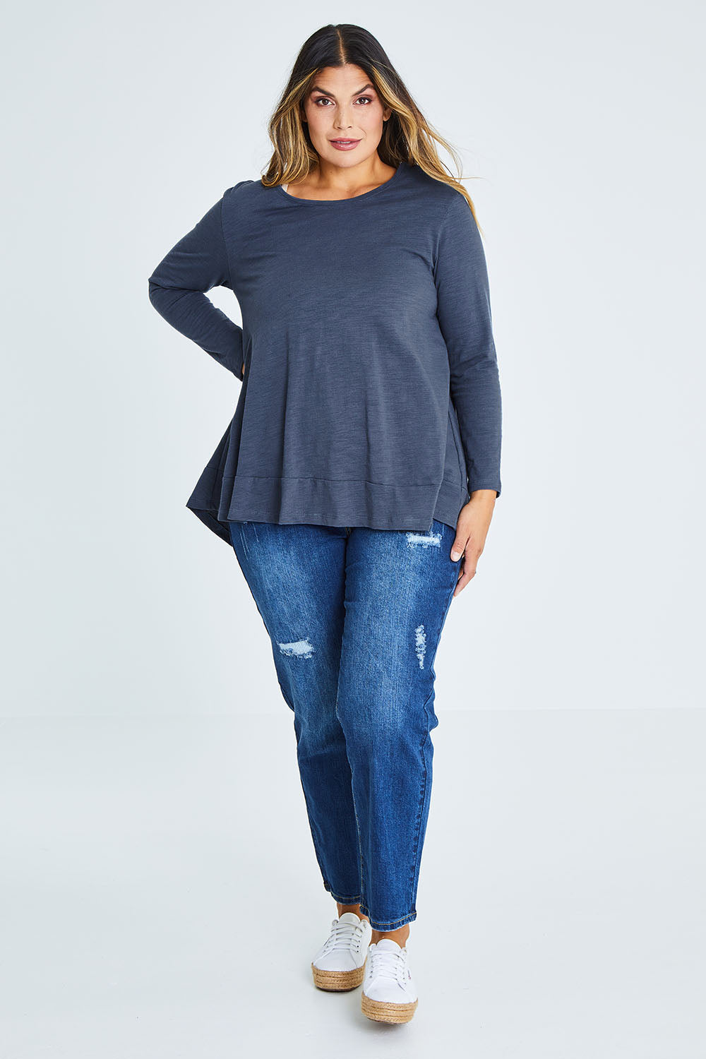 Model Palatina wearing size 16 of The Long Sleeve Swing Tee in colour Slate (Grey), from the front, showing the whole outfit