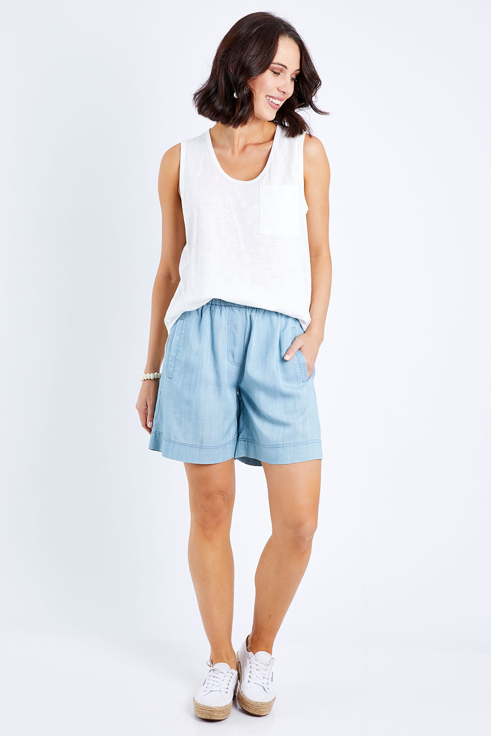 Model Andrea wearing size 10 of The Chambray Walk Short in colour Chambray (Blue), from the front, showing the whole outfit