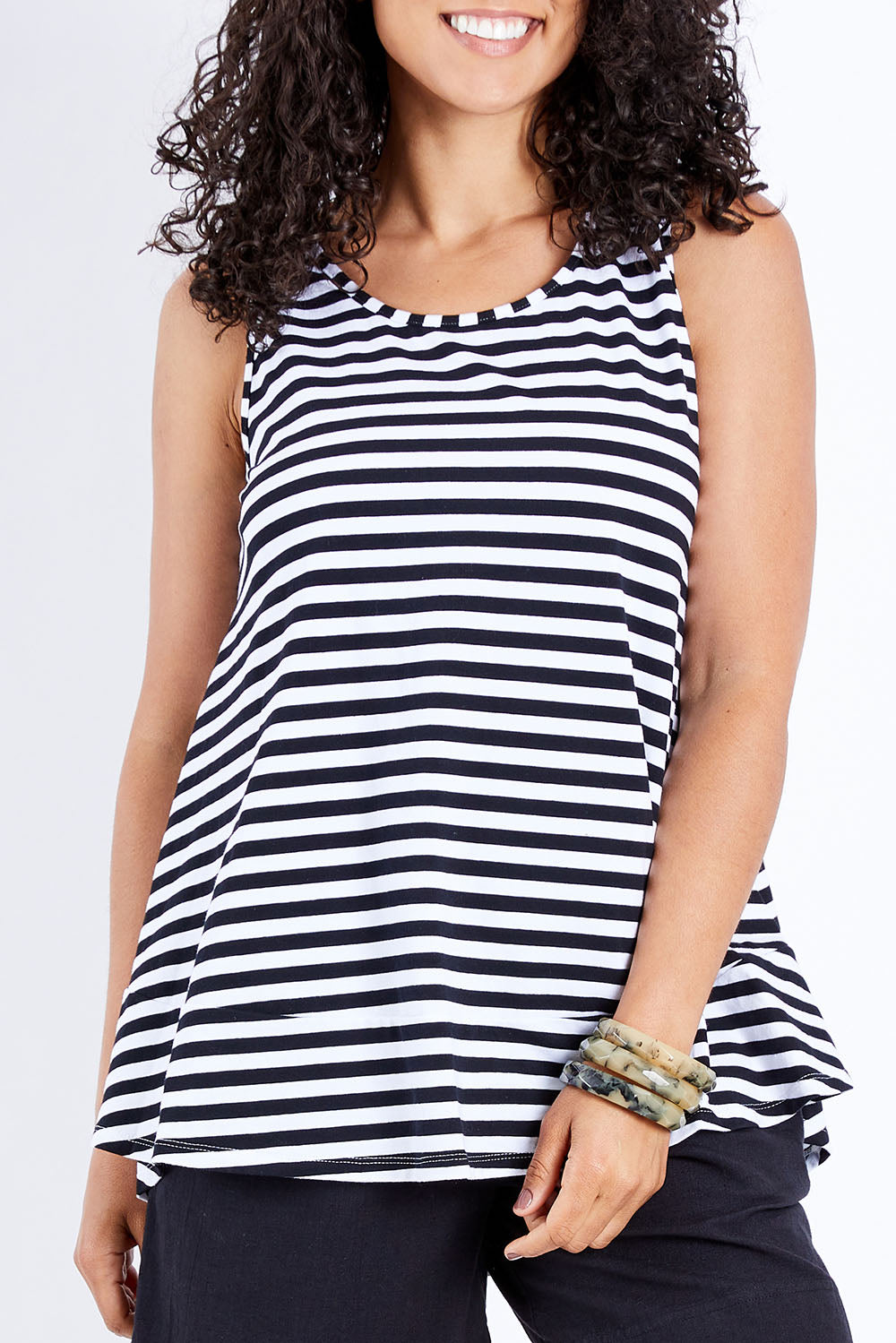 Model Pamela wearing size 10 of The Swing Tank in colour Blkstripe (Black), from the front, cropped image