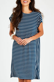 Model Vitoria wearing size 10 of The Summer Stripe Dress in colour Inkpetrol (Blue), from the front, cropped image
