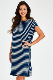 Model Vitoria wearing size 10 of The Summer Stripe Dress in colour Inkpetrol (Blue), from the front, cropped image