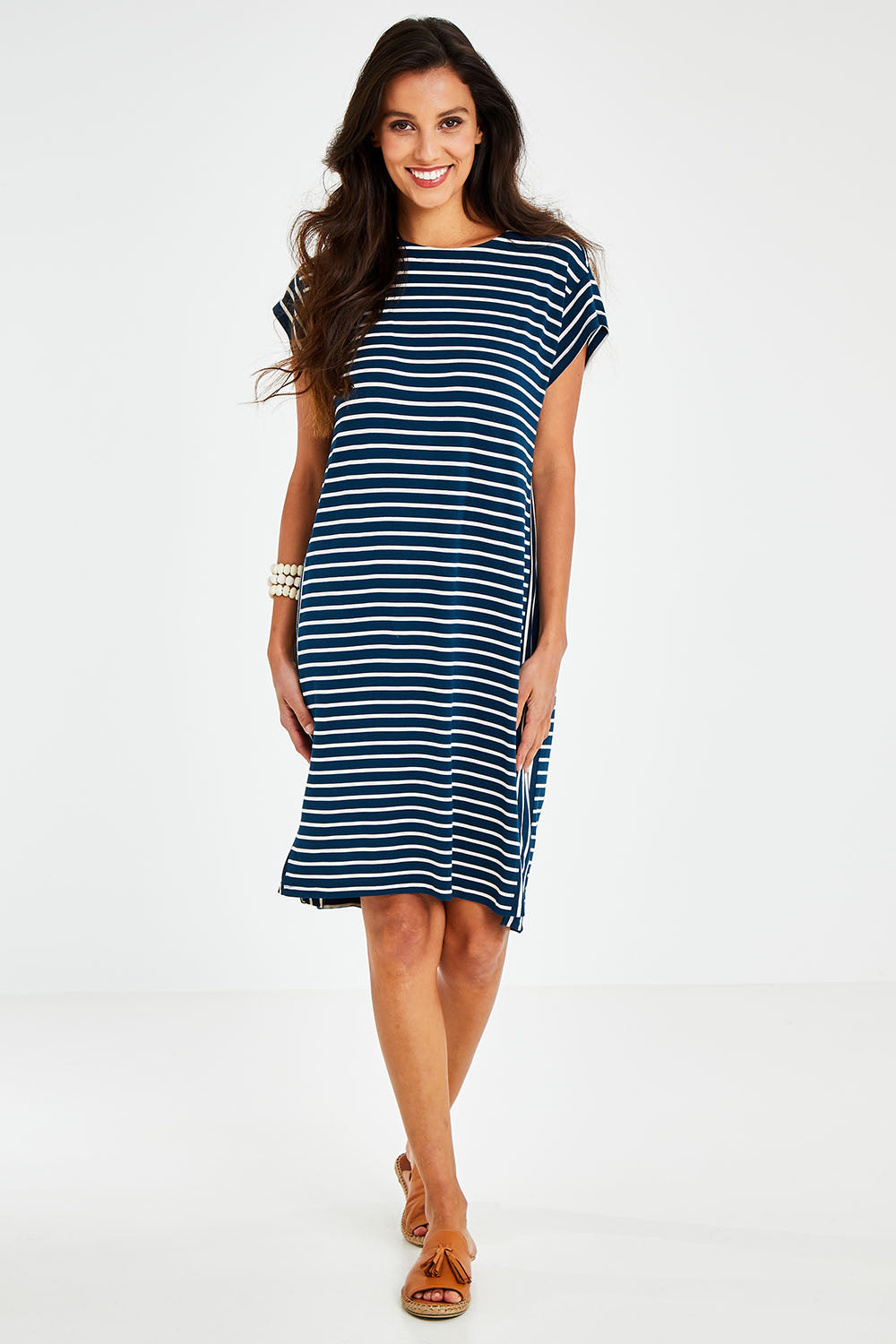 Model Vitoria wearing size 10 of The Summer Stripe Dress in colour Inkpetrol (Blue), from the front, showing the whole outfit