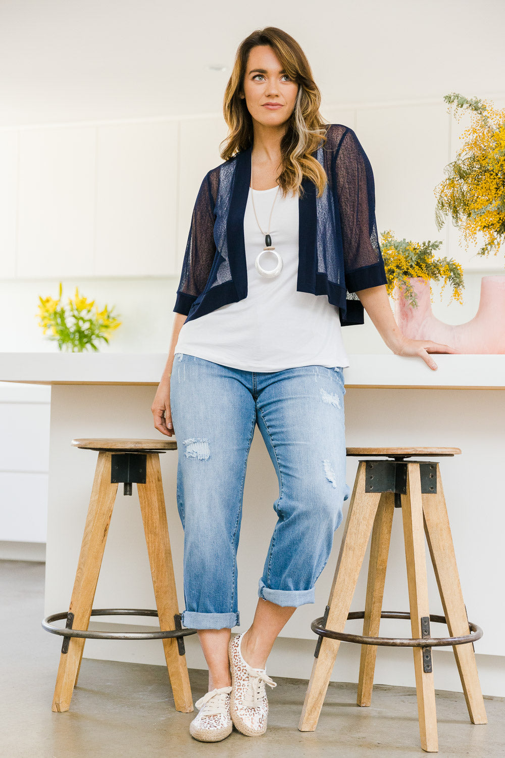 Model Laura wearing size 14 of The Summer Shrug in colour Navy (Blue), from the front, showing the whole outfit