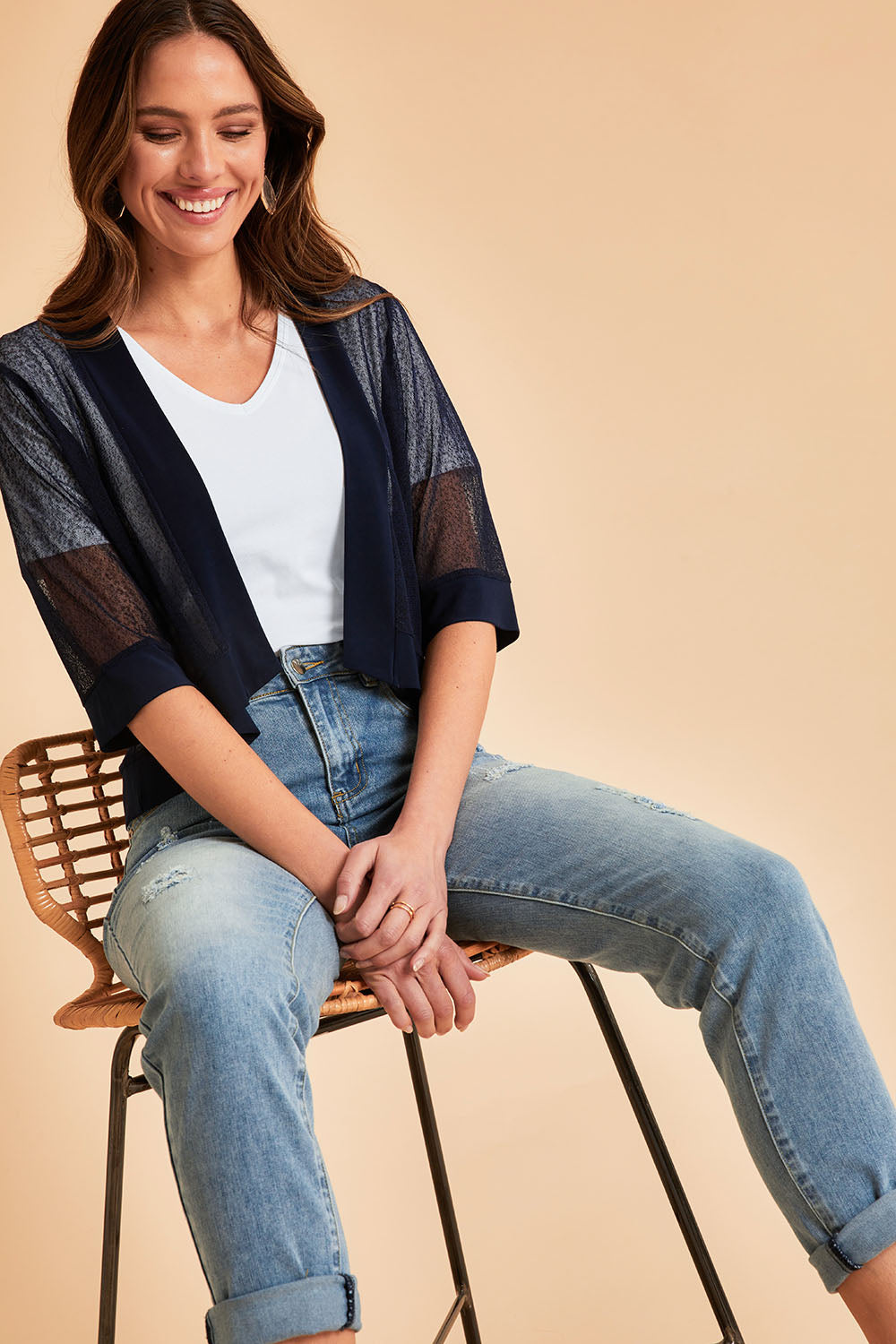Model Madeline wearing size 10 of The Summer Shrug in colour Navy (Blue), from the front, showing the whole outfit