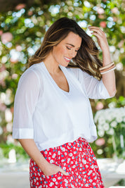 Model Laura wearing size 14 of The Summer Shrug in colour White (White), from the front, showing the whole outfit