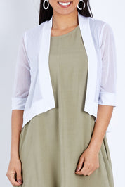 Model Pamela wearing size 10 of The Summer Shrug in colour White (White), from the front, cropped image
