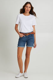 Model Madeline wearing size 10 of The 5 Pocket Denim Short in colour Dkdenim (Blue), from the front, showing the whole outfit
