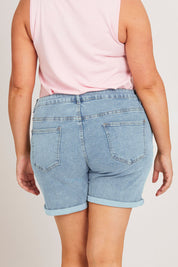 Model Poppys wearing size 16 of the The 5 Pocket Denim Short - Lightdenim in colour Lightdenim, from the back