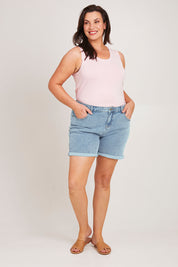 Model Poppys wearing size 16 of the The 5 Pocket Denim Short - Lightdenim in colour Lightdenim, from the front