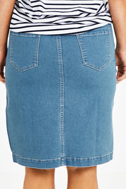 Model Laura wearing size 14 of The Pull On Denim Skirt in colour Middenim (Blue), from the back