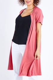 Model Lala wearing size 10 of The Short Sleeve Long Cardi in colour Desertrose (Pink), from the front, cropped image