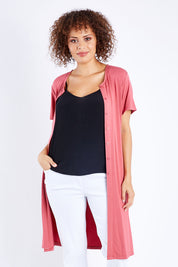 Model Lala wearing size 10 of The Short Sleeve Long Cardi in colour Desertrose (Pink), from the front, cropped image