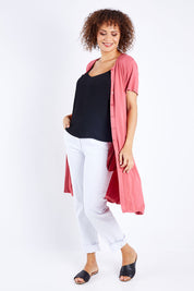 Model Lala wearing size 10 of The Short Sleeve Long Cardi in colour Desertrose (Pink), from the front, showing the whole outfit