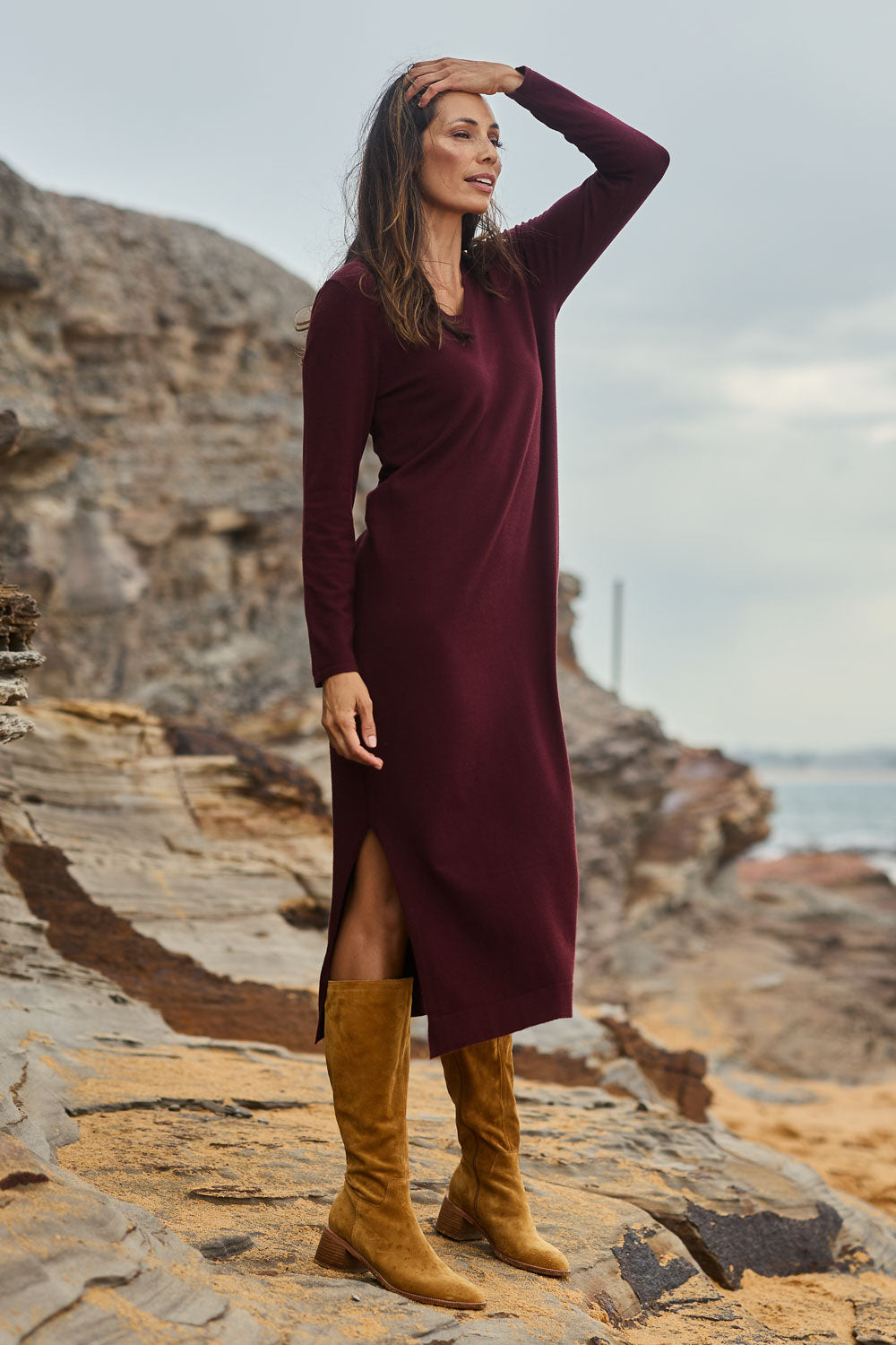 Model Amanda wearing size S of The Comfort True Knit Dress in colour Shiraz (Red), from the front, showing the whole outfit