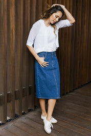 Model Amanda wearing size 10 of The Midi Denim Skirt in colour Darkdenim (Blue), from the front, showing the whole outfit