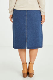 Model Laura wearing size 14 of The Midi Denim Skirt in colour Darkdenim (Blue), from the back