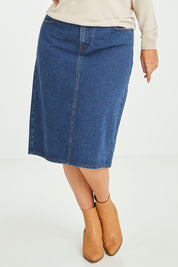Model Laura wearing size 14 of The Midi Denim Skirt in colour Darkdenim (Blue), from the front, cropped image