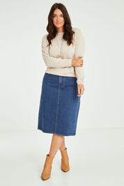 Model Laura wearing size 14 of The Midi Denim Skirt in colour Darkdenim (Blue), from the front, showing the whole outfit