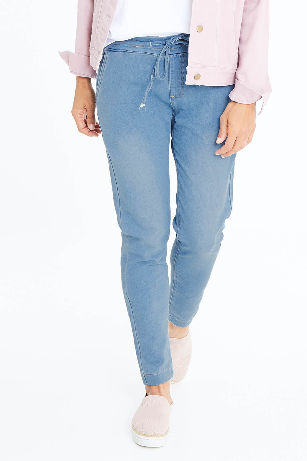 Model Cara wearing size 10 of The Weekend Pull On Jogger Jean in colour Denim (Blue), from the front, cropped image