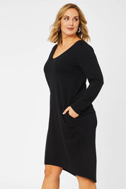 Model Jess wearing size 14 of The V Neck Essential Ponte Dress in colour Black (Black), from the front, cropped image