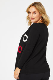 Model Jess wearing size L of The 2 For Spot Jumper in colour Spot (Black), from the back