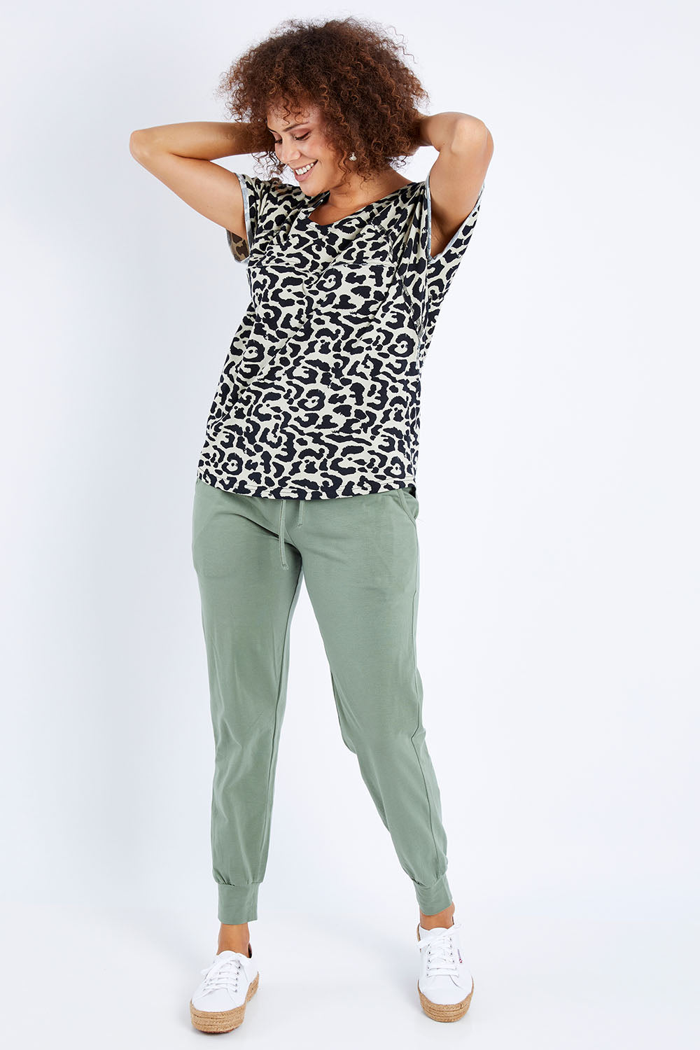 Model Lala wearing size 10 of The Slouch Tee in colour Animal (Green), from the front, showing the whole outfit