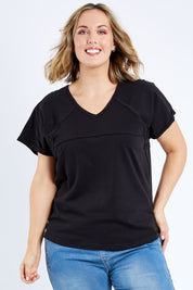 Model Jess wearing size 14 of The Slouch Tee in colour Black (Black), from the front, cropped image