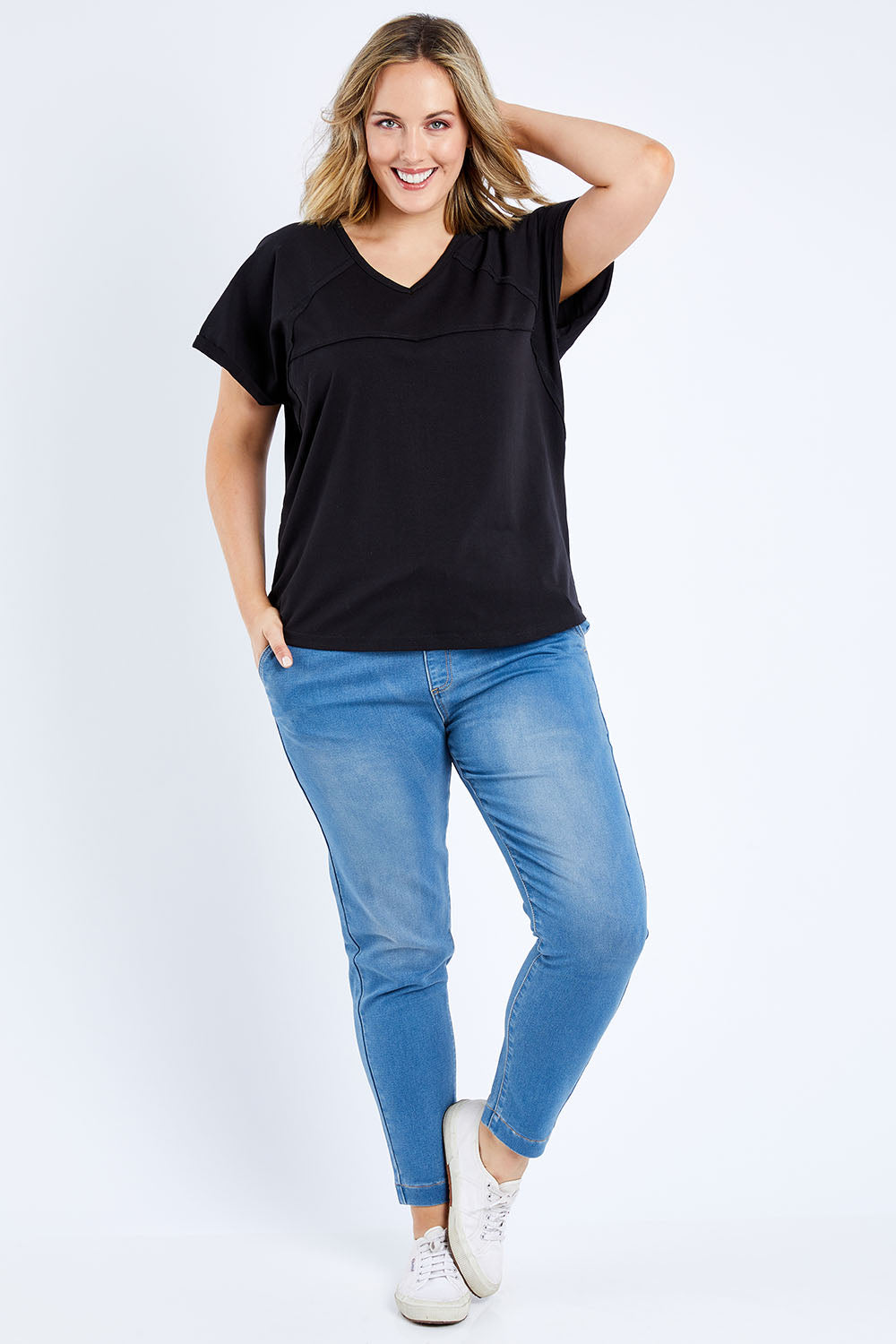 Model Jess wearing size 14 of The Slouch Tee in colour Black (Black), from the front, showing the whole outfit