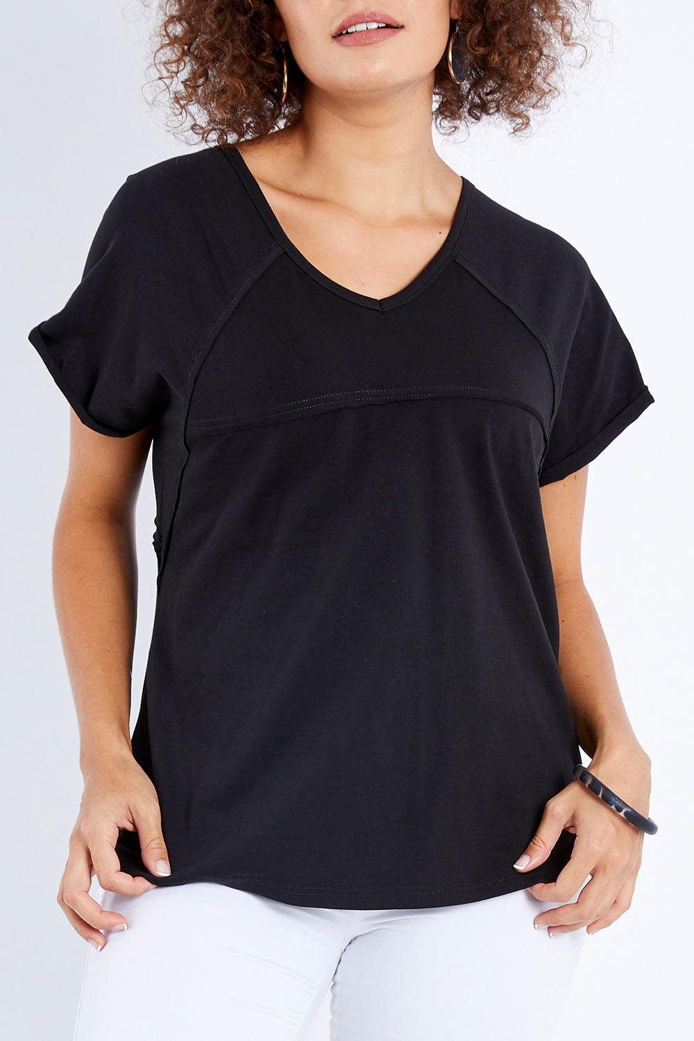 Model Lala wearing size 10 of The Slouch Tee in colour Black (Black), from the front, cropped image