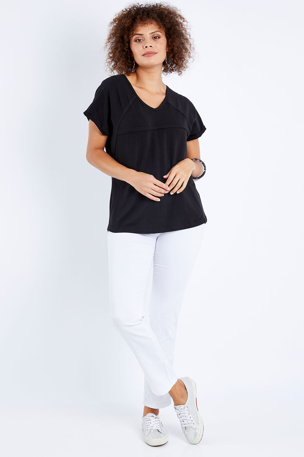 Model Lala wearing size 10 of The Slouch Tee in colour Black (Black), from the front, showing the whole outfit