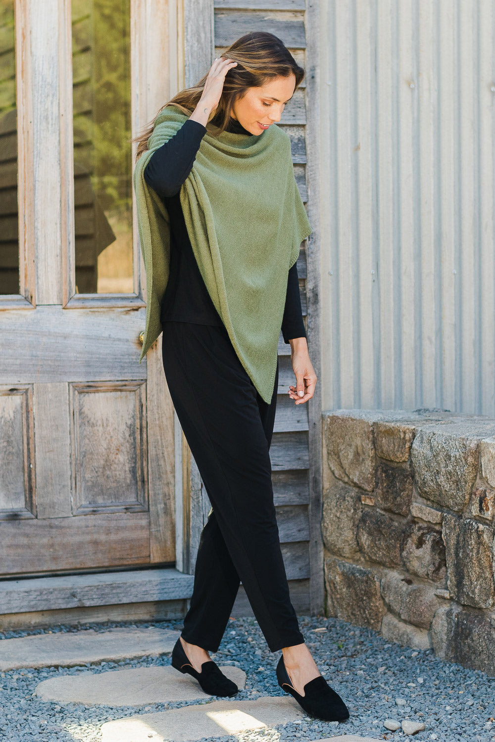 Model Amanda wearing size 10 of The Recycled Flat Front Pull On Pant in colour Black (Black), from the front, showing the whole outfit